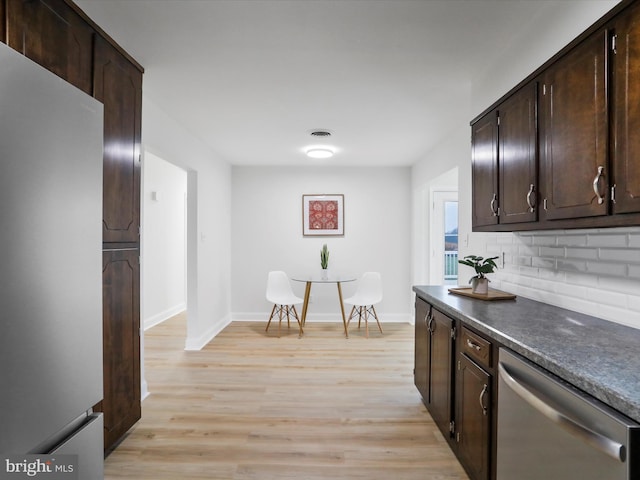 kitchen featuring decorative backsplash, dark brown cabinetry, white refrigerator, light hardwood / wood-style flooring, and dishwasher