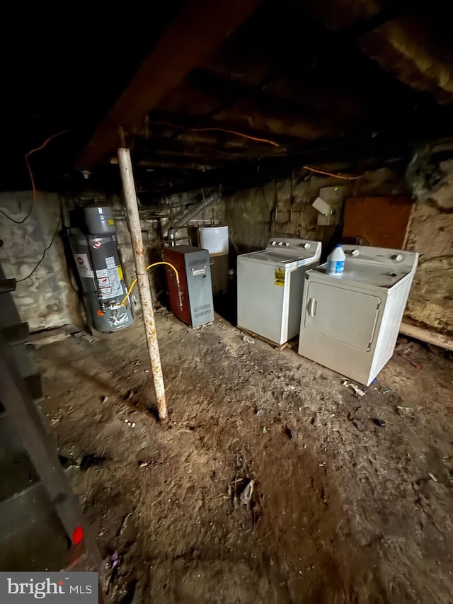 basement with washer and clothes dryer and water heater