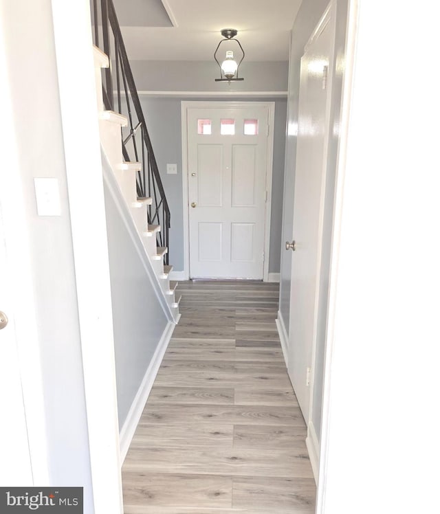 entrance foyer with light hardwood / wood-style floors