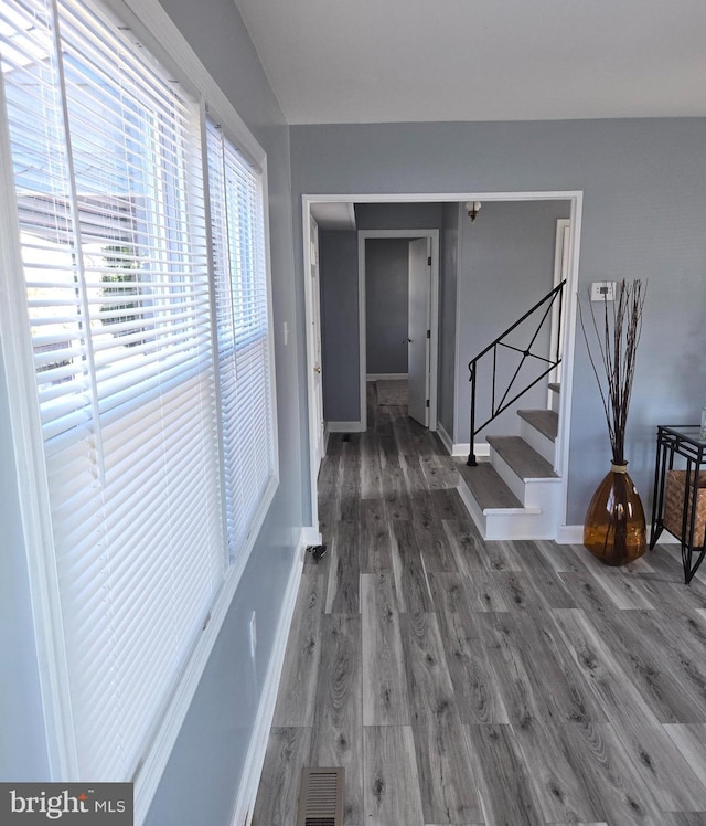 hallway with wood-type flooring