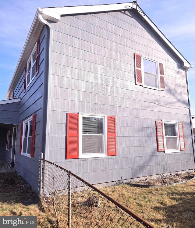 view of home's exterior with a yard