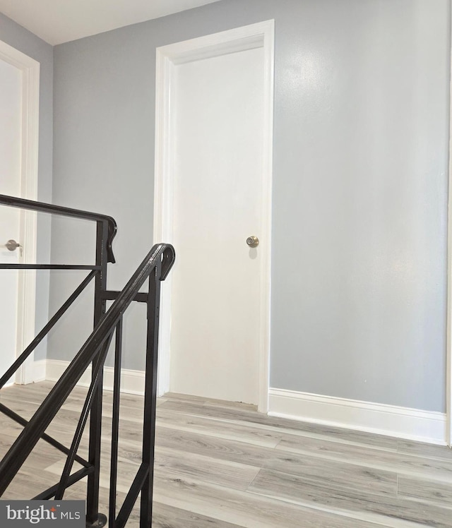 stairway with wood-type flooring