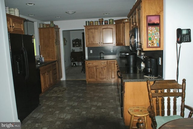 kitchen featuring decorative backsplash and black appliances