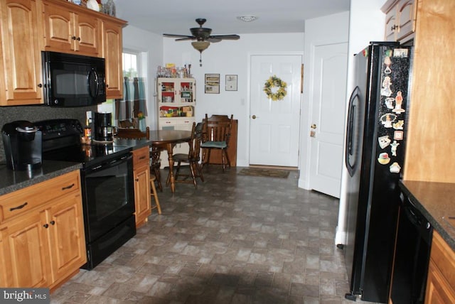 kitchen with ceiling fan, dark stone countertops, and black appliances