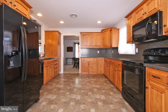 kitchen with decorative backsplash and black appliances