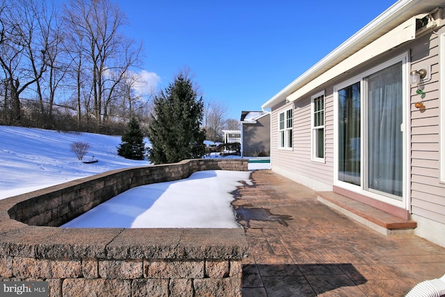 view of snow covered patio