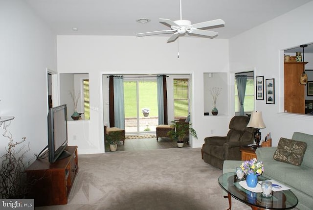 carpeted living room featuring ceiling fan