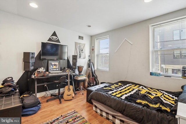 bedroom with hardwood / wood-style floors