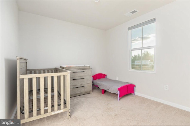 bedroom with light carpet