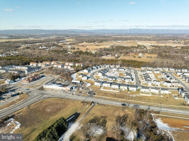 birds eye view of property with a mountain view