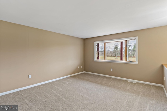 unfurnished room featuring carpet floors