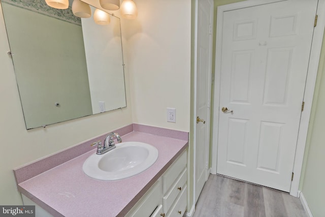 bathroom featuring vanity and hardwood / wood-style flooring