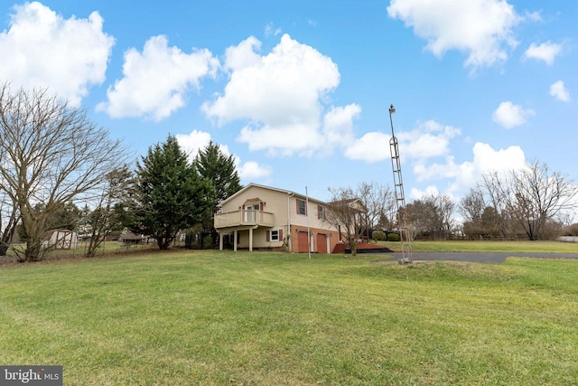 view of yard with a garage and a deck