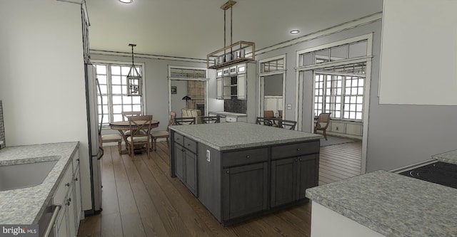 kitchen with pendant lighting, a center island, gray cabinets, and dark wood-type flooring