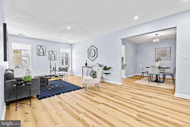 living room with light hardwood / wood-style floors