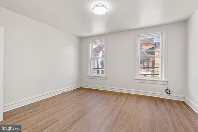 unfurnished room with light hardwood / wood-style floors