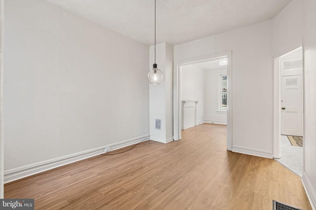 unfurnished dining area featuring light hardwood / wood-style floors