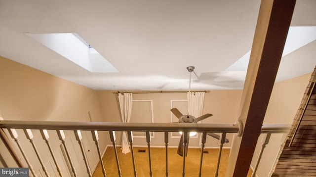 hallway featuring a skylight