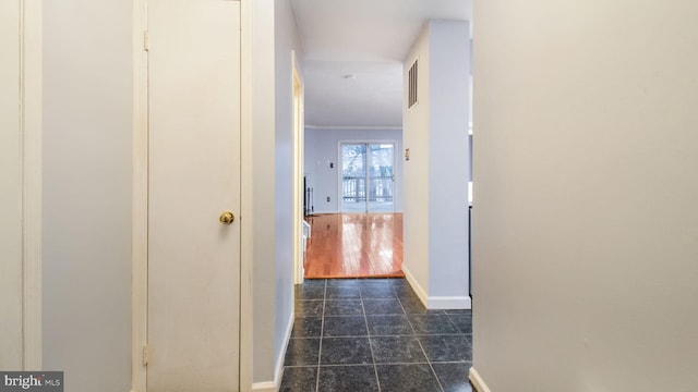 hallway featuring crown molding