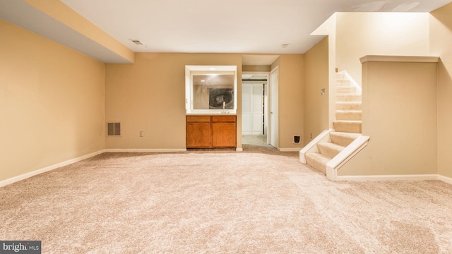 unfurnished living room with carpet flooring