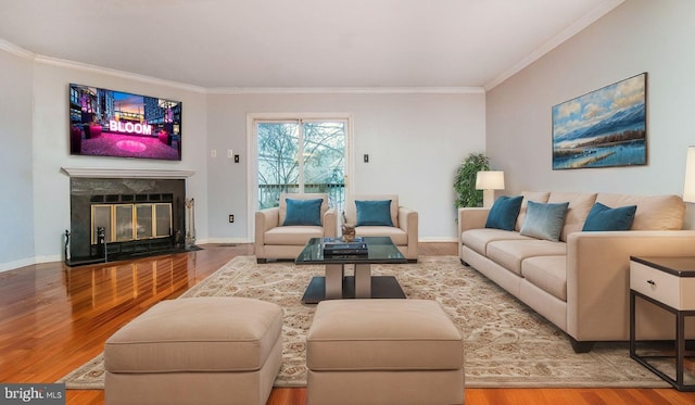 living room featuring hardwood / wood-style floors and ornamental molding