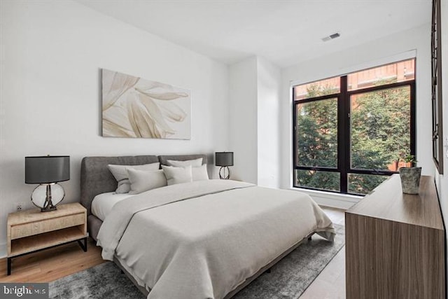 bedroom with light wood-type flooring