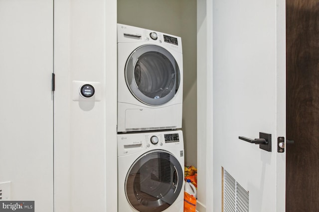 washroom with stacked washer / dryer