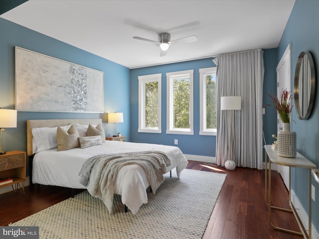 bedroom featuring ceiling fan and dark hardwood / wood-style floors