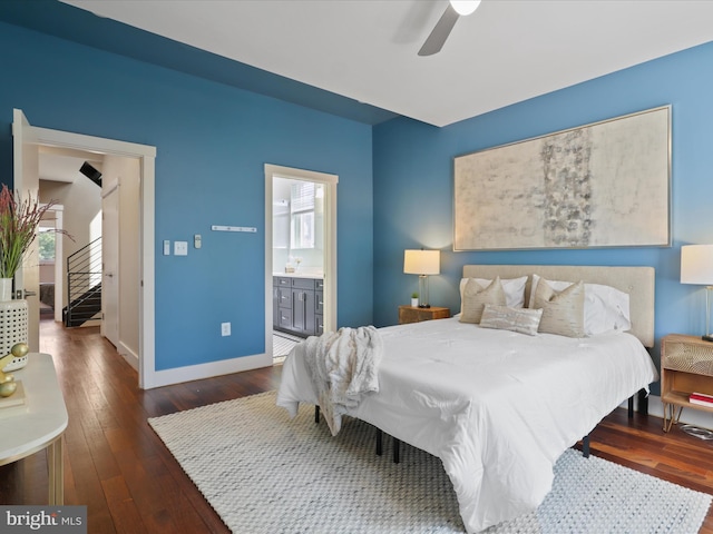 bedroom featuring connected bathroom, dark hardwood / wood-style floors, and ceiling fan