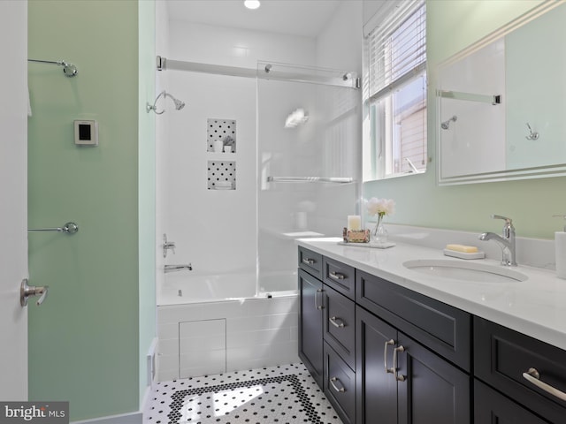 bathroom with vanity and combined bath / shower with glass door