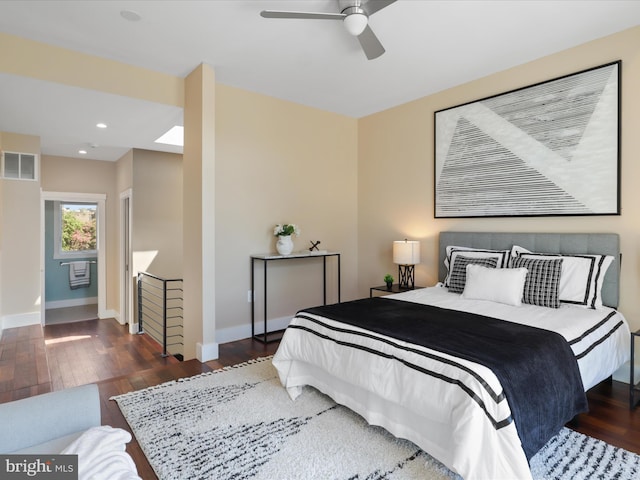 bedroom featuring ceiling fan and dark hardwood / wood-style floors