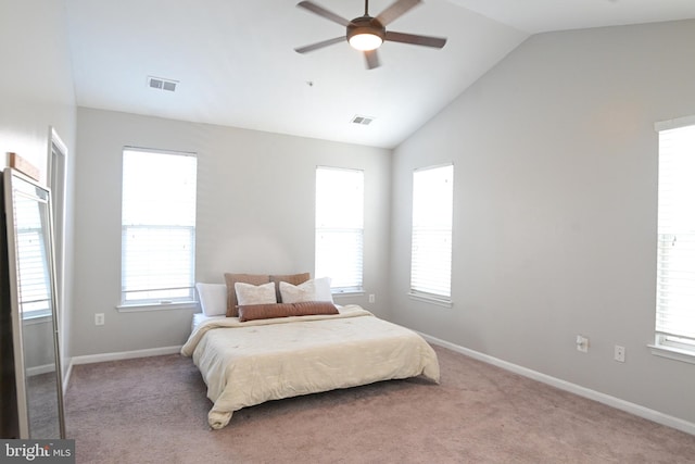 bedroom with ceiling fan, light carpet, and lofted ceiling