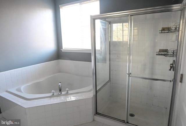 bathroom with shower with separate bathtub