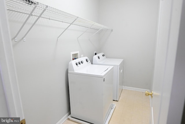 laundry area with washing machine and dryer