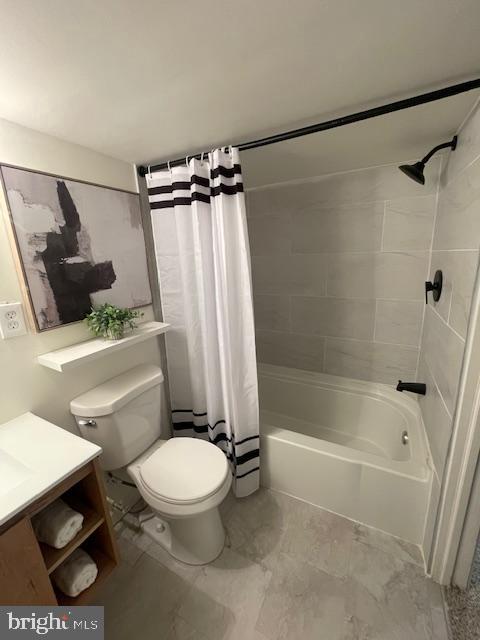 full bathroom with shower / bath combination with curtain, toilet, and vanity