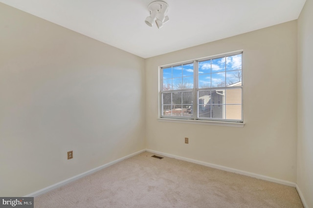 view of carpeted spare room