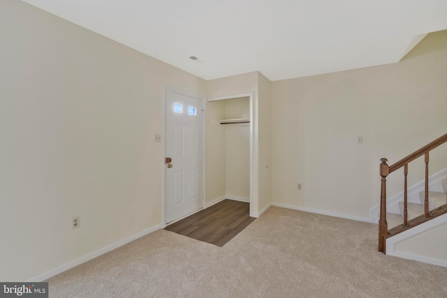 entryway featuring carpet floors