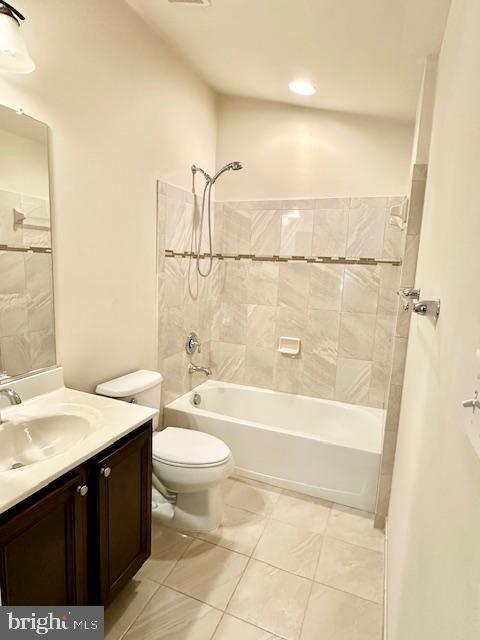 full bathroom with tile patterned flooring, vanity, toilet, and shower / tub combination