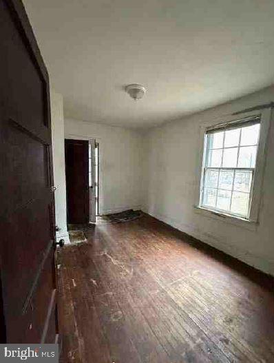 interior space with dark hardwood / wood-style flooring