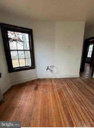 empty room with wood-type flooring