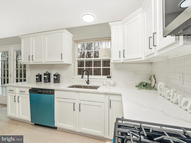 kitchen with white cabinets, dishwasher, and sink