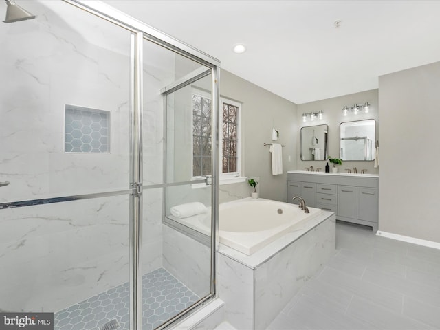 bathroom featuring tile patterned flooring, vanity, and independent shower and bath