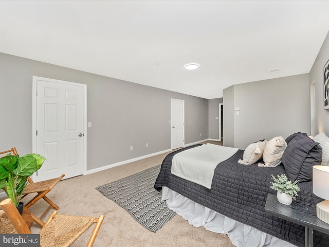 bedroom featuring light carpet