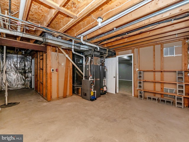 basement with gas water heater and heating unit