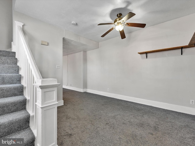 stairway featuring carpet and ceiling fan