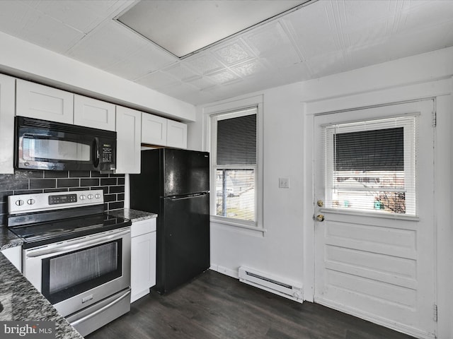 kitchen with a baseboard heating unit, black appliances, dark stone countertops, white cabinets, and dark hardwood / wood-style floors