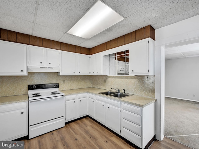 kitchen featuring white cabinetry, sink, and white electric range