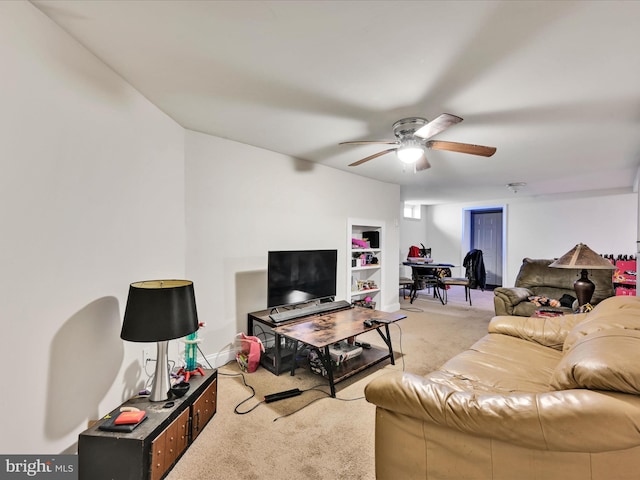 living room with ceiling fan and light colored carpet