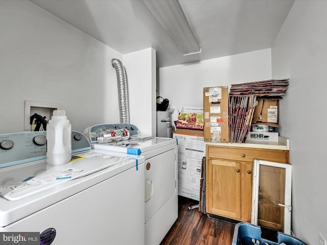 laundry area with cabinets, dark wood-type flooring, and washing machine and clothes dryer