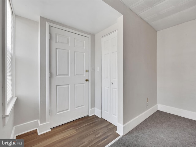 foyer with dark carpet